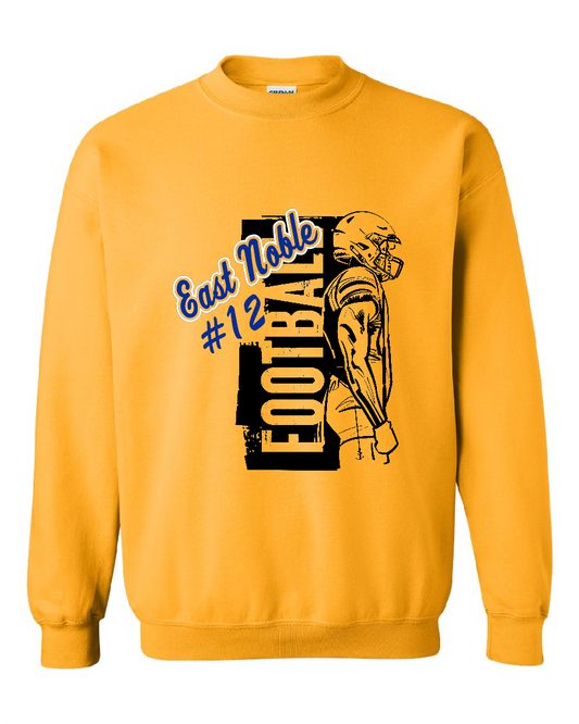 A yellow gold crewneck sweatshirt featuring a graphic print of a football player and the text 'East Noble #12 FOOTBALL' in blue and black.