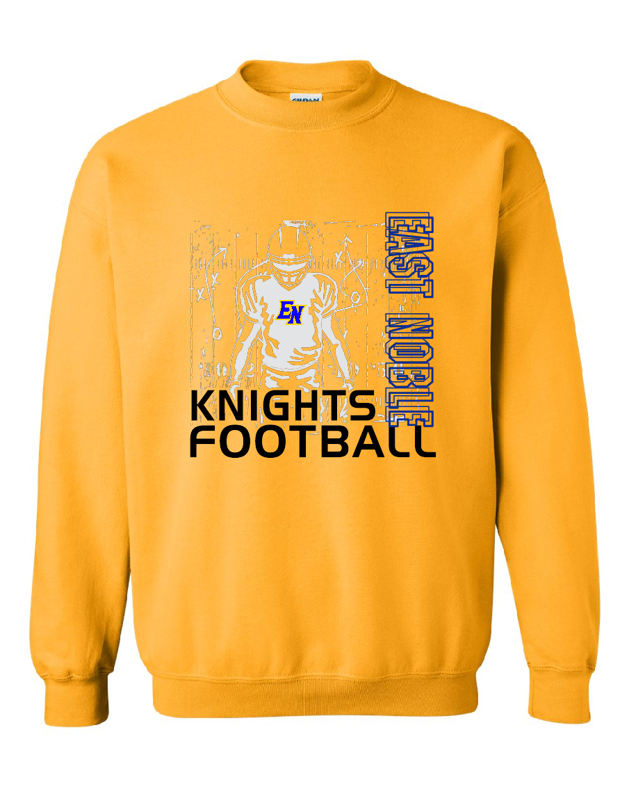 A gold crewneck sweatshirt featuring a graphic design on the front with a football player illustration, the text 'EAST NOBLE KNIGHTS FOOTBALL' in black and blue, and 'EN' in the center.