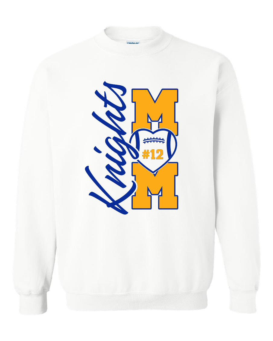 A white crewneck sweatshirt featuring a blue and yellow graphic on the front. The design displays the word 'Knights' in blue script alongside two large yellow block letters 'M' and 'M' stacked vertically, with a blue and yellow football heart in the center containing the text '#12'.